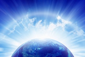 Abstract peaceful background - planet Earth, bright sun shines, blue sky, eternity and heaven. Elements of this image furnished by NASA